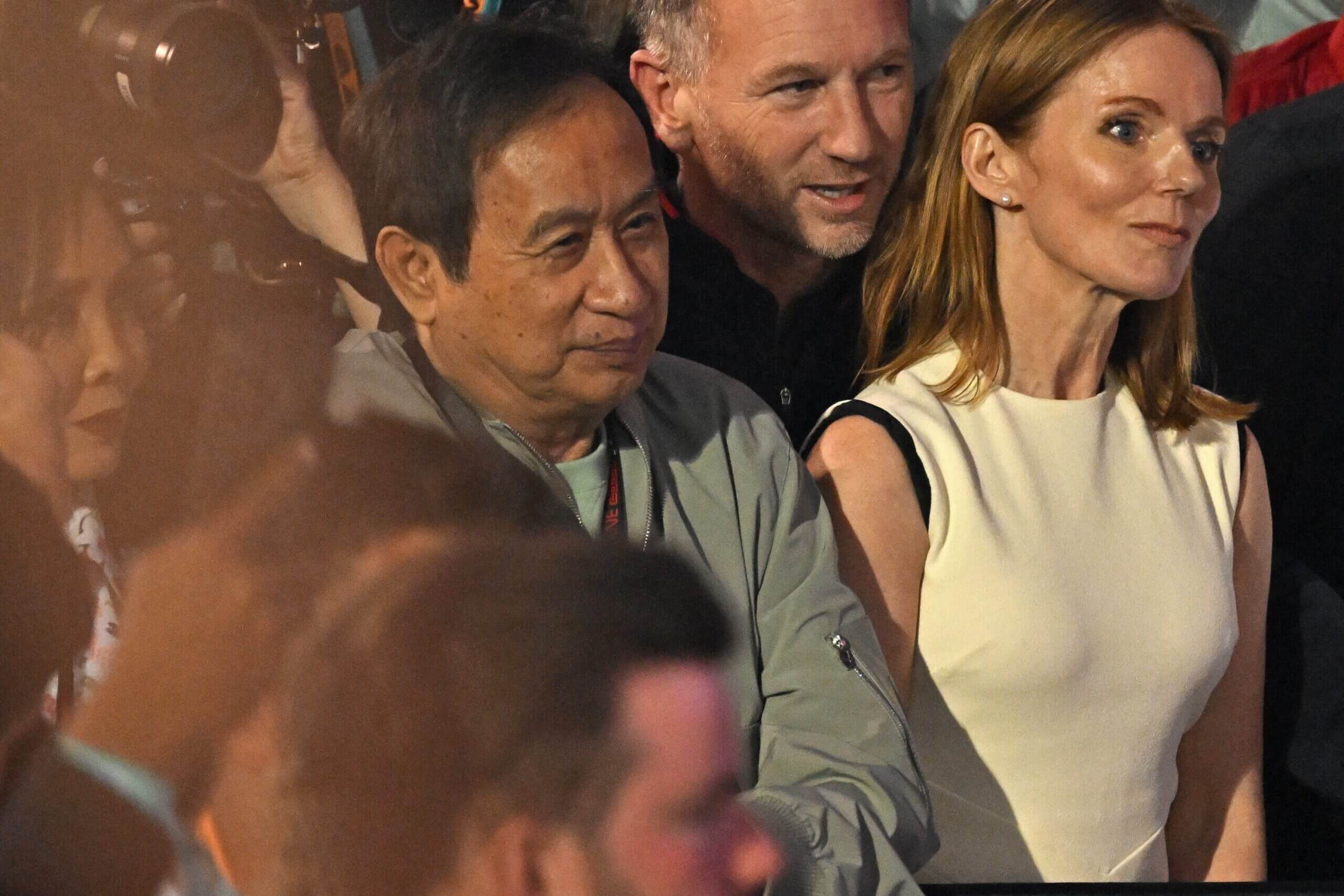 Red Bull Racing team principal Christian Horner (2R) along with his wife British singer Geri Halliwell (R) and Thai businessman Chalerm Yoovidhya (C) and his wife Daranee Yoovidhya (L) attend the podium ceremony of the Bahrain Formula One Grand Prix at the Bahrain International Circuit in Sakhir on March 2, 2024. (Photo by ANDREJ ISAKOVIC / AFP)